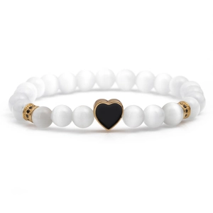 White cat eye stone beaded bracelet with black heart charm and gold accents