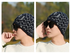 Detailed views of navy knit beanie with letter jacquard pattern and embroidered logo