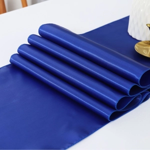 Blue satin table runner with smooth silk texture for luxury wedding and hotel decor