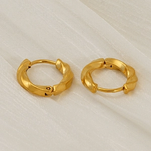 Minimalist gold-plated stainless steel twisted hoop earrings in a classic huggie style