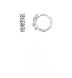 Detail view of S925 sterling silver hoop earrings with three prong-set Moissanite stones