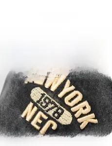 Close-up of yellow 3D embroidery showing New York 1978 on a washed cotton baseball cap