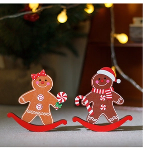 Christmas gingerbread man wooden rockers with festive holiday tree and warm lights background