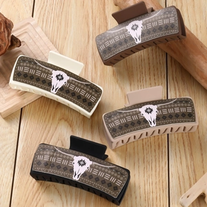 Square PU leather hair claws with tribal bull head prints in four assorted neutral colors