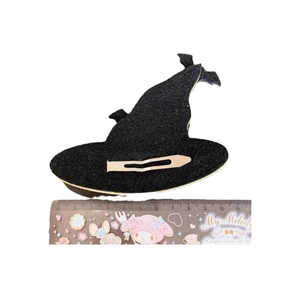 Black felt witch hat hair clip with sequins for Halloween on a white background
