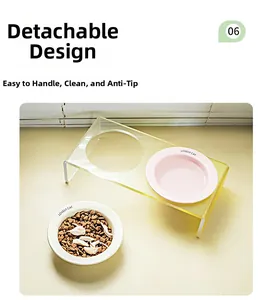 Close-up of ceramic pet bowls on a clear acrylic stand with a split detachable design