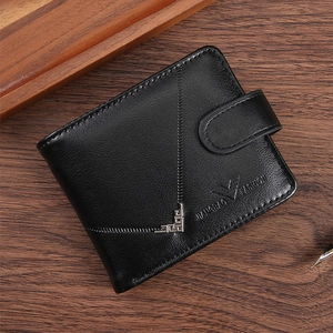 Short leather wallet for men on dark wood background with zipper and snap button closure
