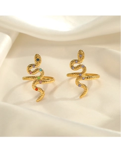 Detail of snake rings in gold plating with colorful cubic zirconia on silk fabric