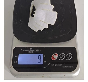 Detailed view of translucent wavy hair claw clip showing its 9g lightweight design