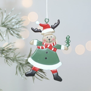 Handcrafted iron Christmas reindeer ornament with a festive scarf hanging on a decorated tree