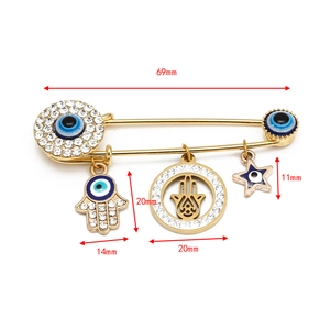 Detailed view of the 69mm gold evil eye brooch dimensions with Hamsa hand charms
