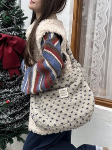 Winter plush heart tote bag with large capacity shown in a cozy festive shopping scene