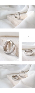 Macro detail of S925 sterling silver hallmark on minimalist polished wide open ring