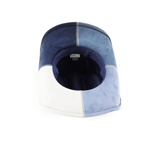 Detailed inner view of blue suede jazz hat showing the stitched sweatband and brand label