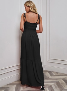Rear view of long black backless dress with lace-up straps and elastic smocked detail