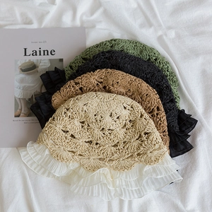 Flat lay of woven straw hats featuring pleated chiffon lace edges in four various colors