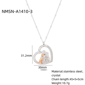 Detail view of crystal heart pendant with figure hugging cat and material specs