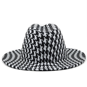 Detailed close-up of the black and white houndstooth pattern on a wool felt jazz hat