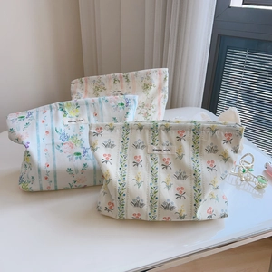 Floral print cotton zipper makeup bag with simple wish label and soft floral patterns