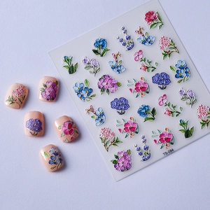 Close-up of 5D floral nail stickers with embossed 3D flower patterns and colorful petals