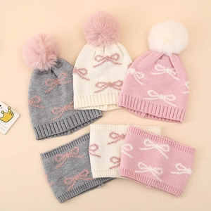 Winter baby hat and scarf set with jacquard bow and large faux fur pompom in pink white grey