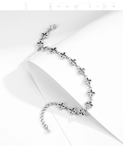 Detailed macro view of S925 sterling silver cross chain bracelet with lobster clasp