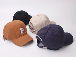 Detailed close-up showing embroidered letter P and color variants of children baseball cap