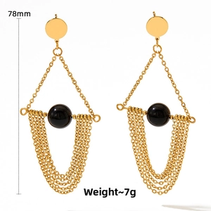 Detail view of gold tassel earrings with black agate showing 78mm length and 7g weight