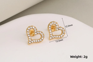 Close-up of gold heart stud earrings with cubic zirconia, size 12.5mm and 2g weight