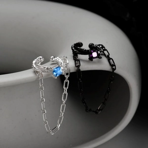 Detailed close-up of S925 sterling silver ear cuffs with square gems and chain links