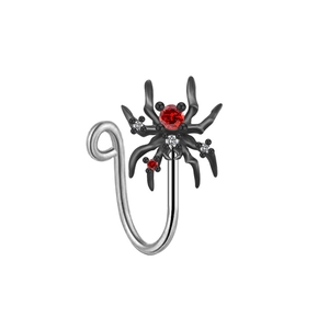 Macro detail of spider non-pierced nose ring with red zircon and black metal finish