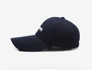Detailed side view of navy blue cotton baseball cap with white Active letter embroidery