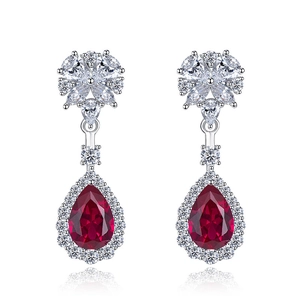 Elegant floral drop earrings with pear-cut red rubies and sparkling floral crystal clusters
