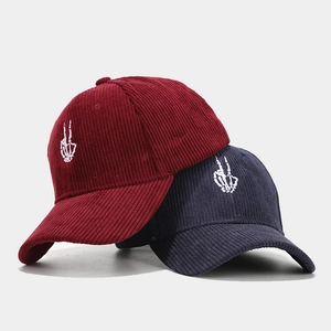 Corduroy baseball caps with skull hand embroidery in burgundy and navy blue colors