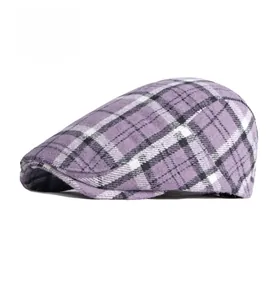 Detail view of purple plaid wool flat cap with vintage check pattern and thick texture