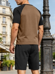 Detail of men's color-block V-neck set showing waffle texture and raglan sleeves