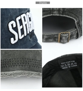 Detailed macro of 3D embroidery and vintage washed cotton fabric on baseball cap
