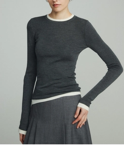 Detail of wool blend slim-fit knit top with layered white contrast collar and cuffs
