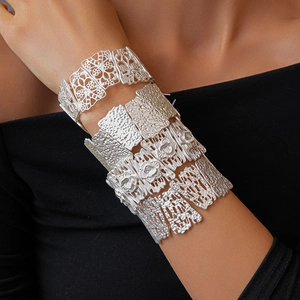Bohemian silver wide bangles with hollow flower patterns and hammered metal texture