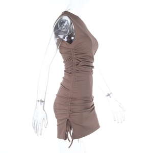 Close-up of side drawstring ruching detail on brown ribbed knit bodycon dress