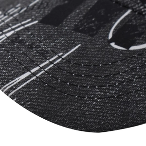 Macro shot of baseball cap brim featuring gradient patterns and white parallel stitching