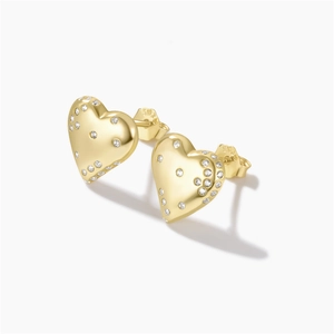 Macro shot of gold heart studs featuring micro-pave white diamonds and S925 hallmark