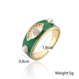 Detail view of gold Evil Eye ring with green enamel, pearls and dimensions 1.8cm 0.8cm