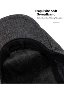 Detail of the grey cotton newsboy cap showing the black inner sweatband and neat stitching