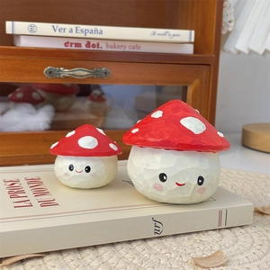 Close-up of cute mushroom desk ornaments with hand-carved texture and warm lighting
