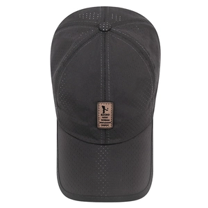 Breathable dark gray baseball cap with laser-cut holes and leather patch detail