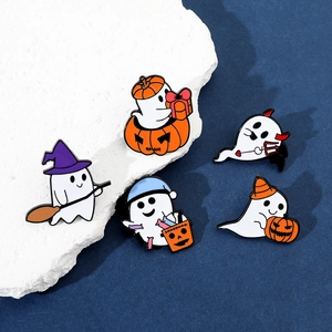Macro detail of five Halloween ghost enamel pins featuring pumpkin and wizard hat designs