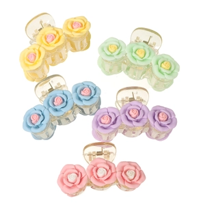 Five colorful resin flower hair claws in yellow, green, blue, purple, and pink floral style