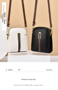 Detailed view of mini vertical crossbody phone bags in black and white lychee texture