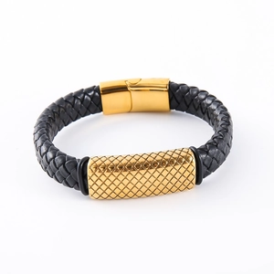 Detailed view of men's braided leather bracelet with golden textured metal clasp